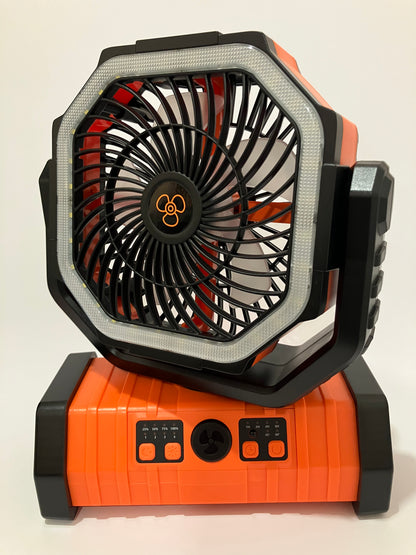 An octagonal portable fan and speaker combo in orange and black, shown from an angled top view against a plain off-white background.